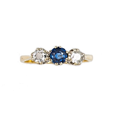 Lot 112 - An 18ct gold sapphire and diamond three stone ring