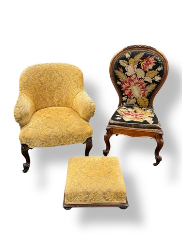 Lot 615 - A Victorian walnut tub chair with carved...