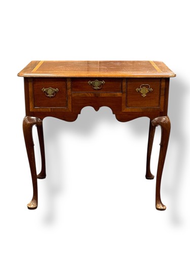 Lot 606 - A 19th century mahogany and inlaid lowboy,...