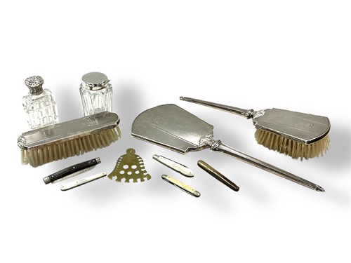 Lot 235 - A silver backed three-piece dressing table set,...