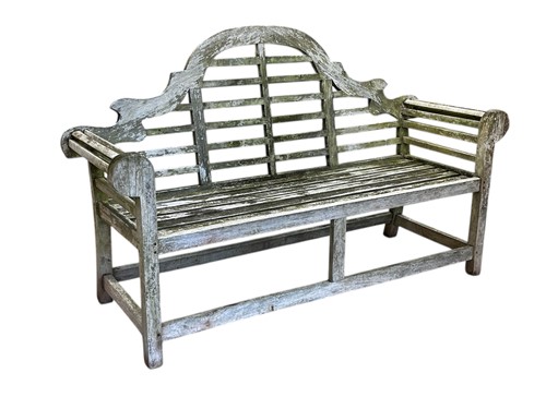 Lot 691 - A Lutyens style teak garden bench, with...