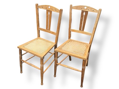 Lot 562 - A pair of Arts and Crafts beech bedroom chairs...
