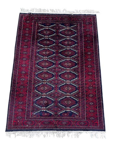 Lot 698 - A Bokhara blue ground rug with two rows of...