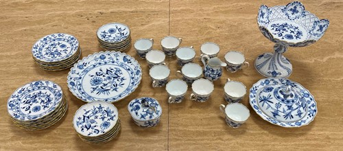 Lot 114 - A Meissen Onion pattern tea service for 12...