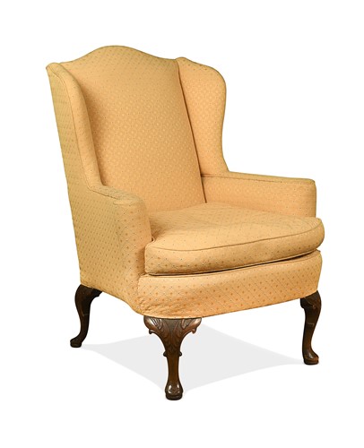 Lot 447 - A George II style walnut wingback armchair