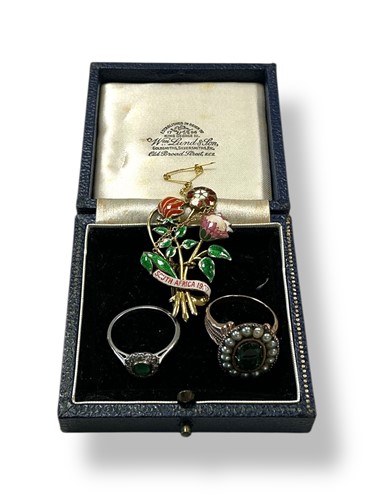 Lot 239 - An emerald and diamond cluster ring, tested as...
