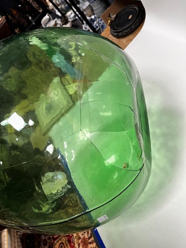 Lot 259 - A large French green glass carboy / demijohn,...
