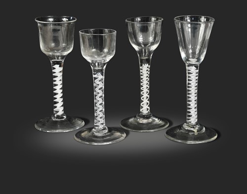 Lot 460 - Four George III air twist wine glasses
