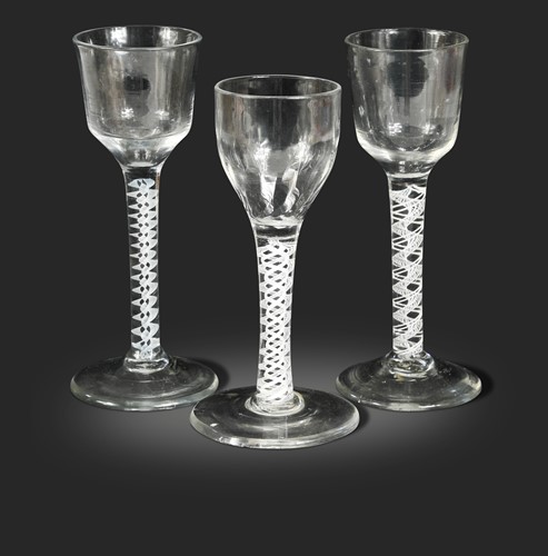 Lot 454 - Three George III air twist wine glasses