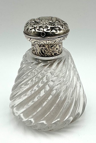 Lot 221 - A repousse silver topped dressing table jar...