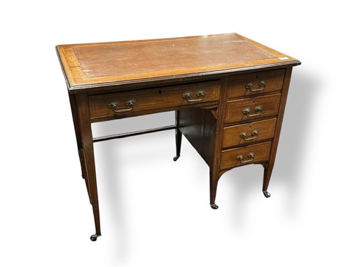 Lot 540 - An Edwardian mahogany kneehole desk,...