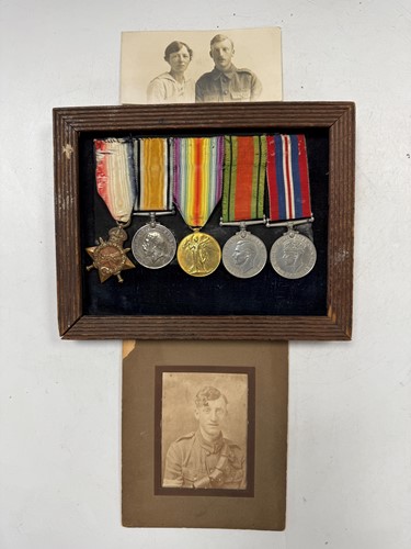Lot 160 - A mounted set of medals together with two photographs