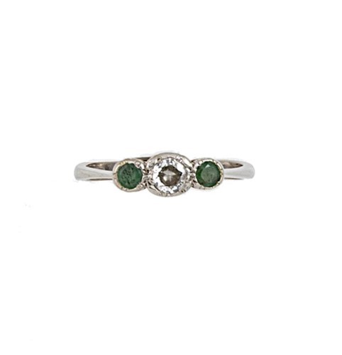 Lot 133 - An 18ct gold diamond and emerald three stone ring
