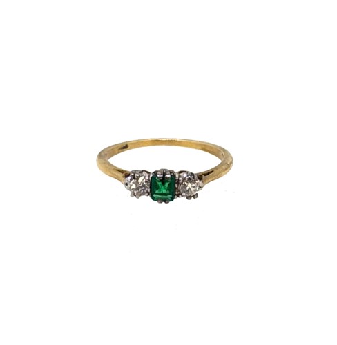 Lot 71 - An emerald and diamond three stone ring