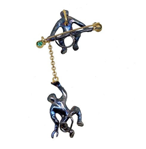 Lot 82 - A diamond, emerald and ruby monkey brooch/pendant