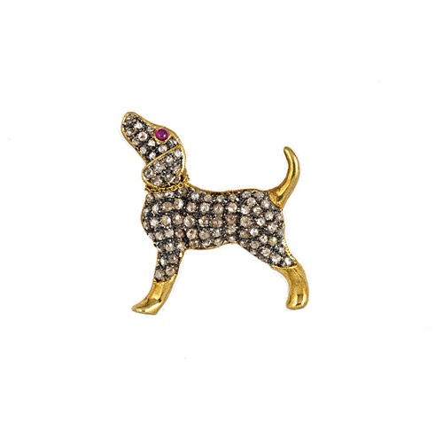 Lot 18 - A diamond, ruby and emerald dog brooch