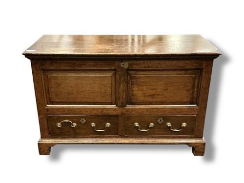 Lot 496 - An 18th century oak mule chest with panelled...