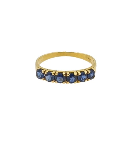 Lot 134 - A sapphire half hoop style ring