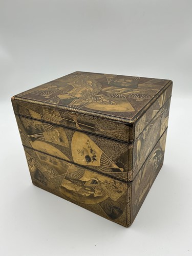 Lot 172 - A nested set of Japanese lacquer stacking gilt...