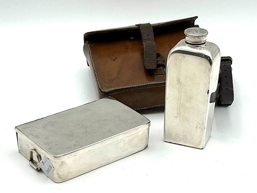 Lot 212 - A silver plated two piece travelling picnic...
