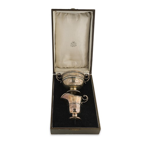 Lot 460 - A George VI silver cream and sugar set