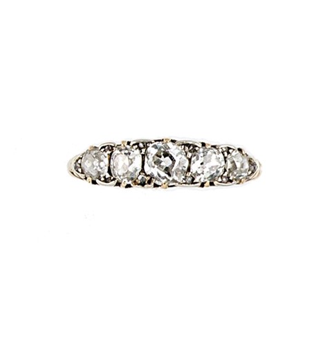 Lot 162 - A diamond set carved half hoop style ring