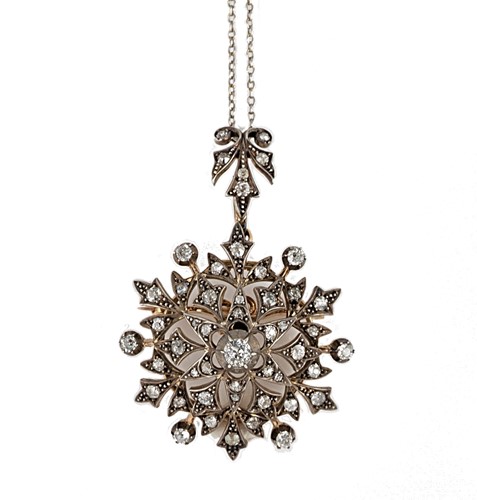 Lot 59 - A diamond set star pendant and chain
