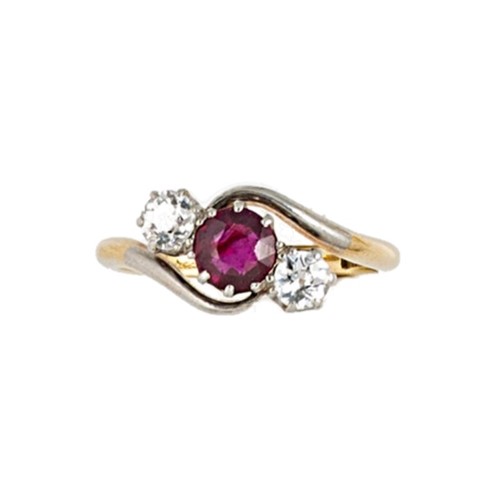 Lot 95 - A ruby and diamond crossover ring