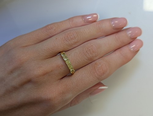Lot 161 - An 18ct gold five stone fancy yellow diamond ring
