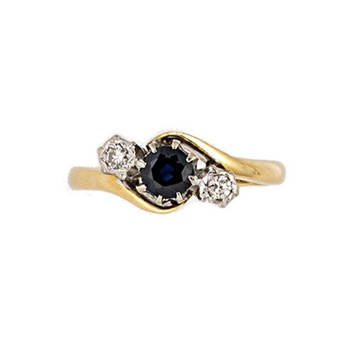 Lot 113 - A late 20th century 18ct gold sapphire and diamond crossover ring