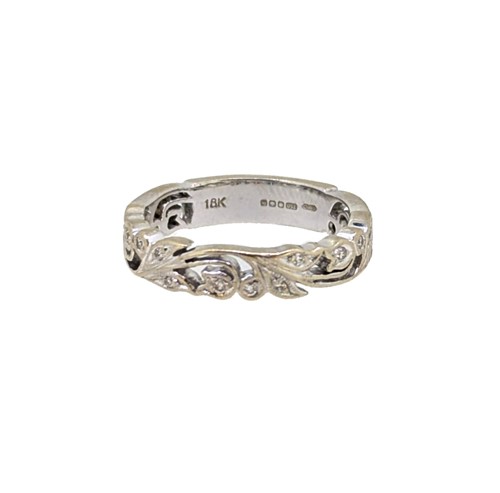 Lot 60 - An 18ct gold diamond set band