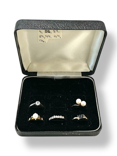 Lot 251 - A group of five stone set rings, assessed as...