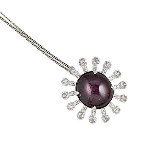 Lot 92 - A star ruby and diamond pendant