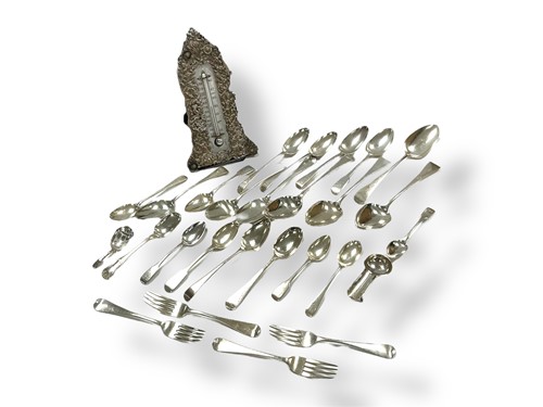 Lot 215 - A collection of silver flatware and a table...