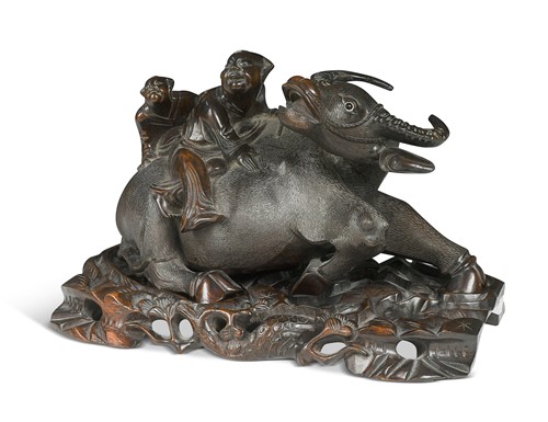 Lot 43 - A Chinese carved wood model of two boys clambering on a water buffalo, early 20th century