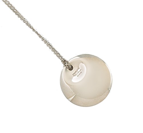 Lot 5 - Elsa Peretti for Tiffany & Co. - A disc pendant and chain