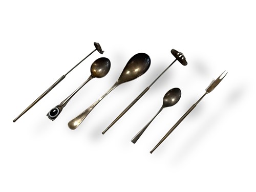 Lot 219 - George Tarratt Ltd., two silver strainers and silver olive forks