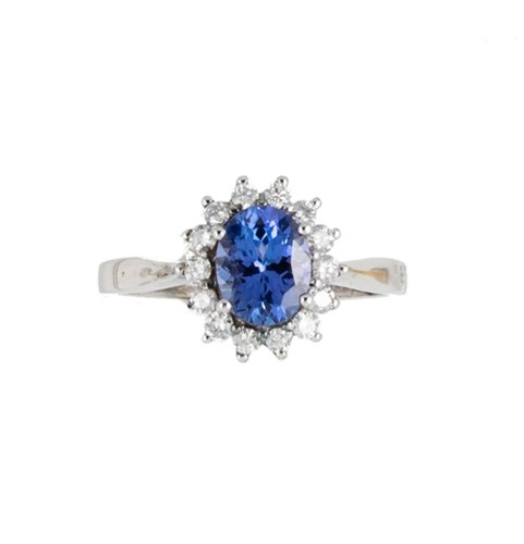 Lot 143 - An 18ct white gold tanzanite and diamond cluster ring