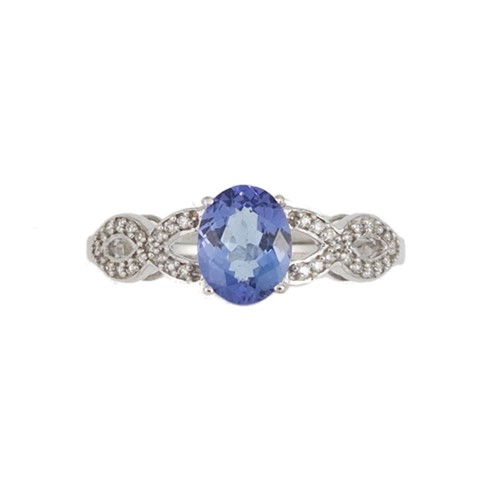 Lot 142 - An 18ct gold tanzanite ring with diamond set shoulders