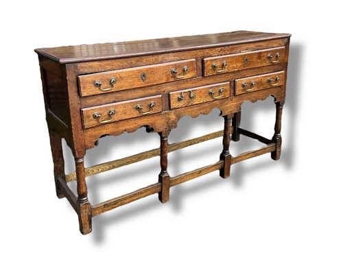 Lot 430 - A late 18th century provincial oak dresser...