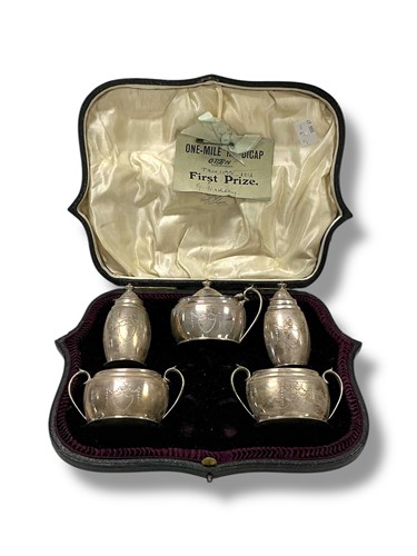 Lot 213 - A cased early 20th century 5 piece silver...