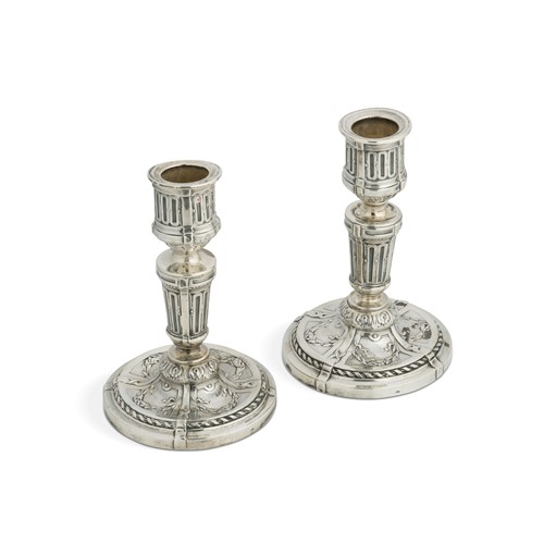 Lot 367 - A pair of early 20th century French metalwares silver library candlesticks