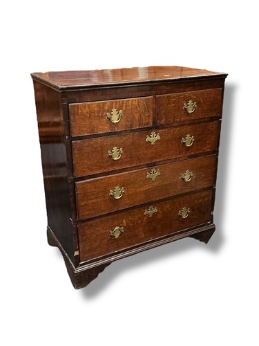 Lot 536 - An oak chest of drawers with two short over...