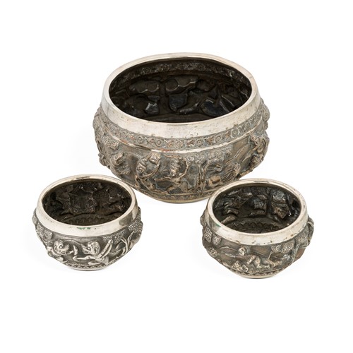 Lot 363 - A late 19th century Burmese metalwares 'Thabeik' bowl, together with two smaller bowls