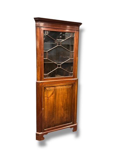 Lot 466 - A mahogany astragal glazed corner cupboard,...