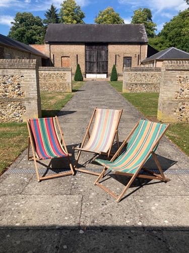Lot 549 - Three vintage folding deckchairs