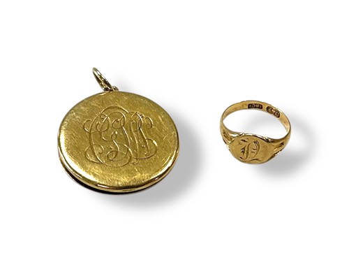 Lot 242 - A locket tested as 18ct gold, together with a...