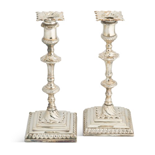 Lot 394 - A near pair of George III 18th century silver candlesticks