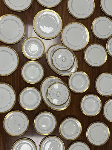 Lot 85 - An extensive white and gilt composite dinner...