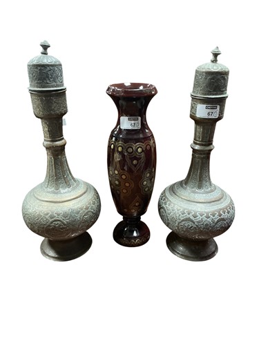 Lot 67 - A pair of Indian copper urns and covers in...